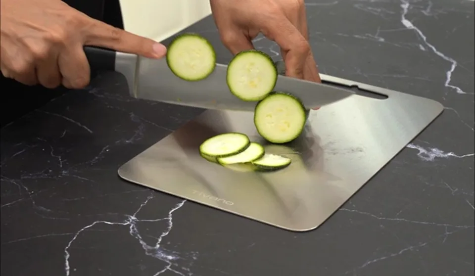 Zucchini being prepared on a Tivano cutting board